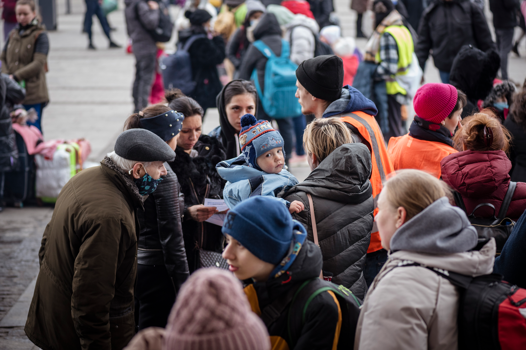 Ukrainians outside the train station in Lviv, Ukraine