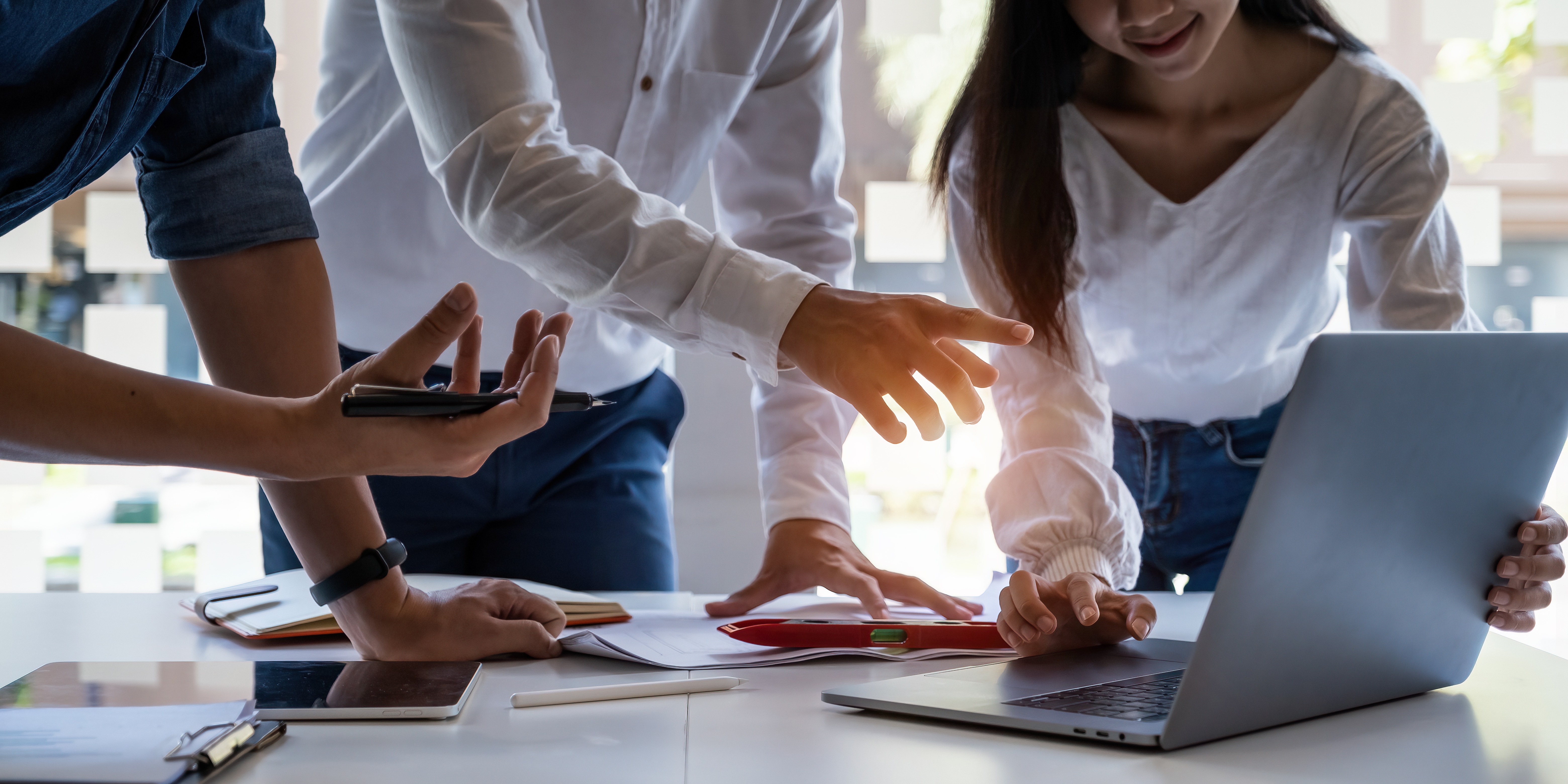 Analytics intelligence concept. Group of business people discuss current financial and economic on laptop for investment at the meeting.