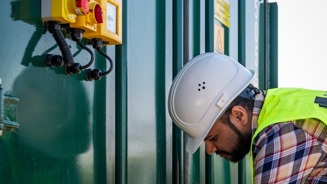 Person maintaining BESS storage unit